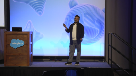 One person on stage presenting to the crowd