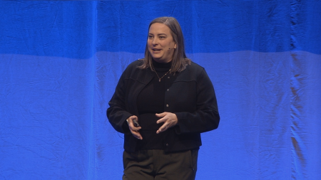 Woman on stage looking to the left