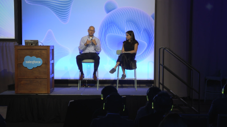 Two people on stage having a conversation