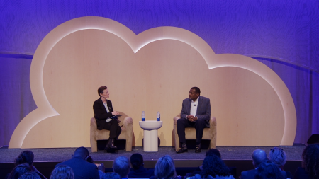 Both speakers man and woman on stage together