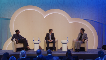 three panelists on stage