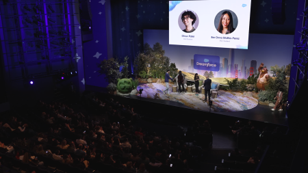 A shot from the balcony showing the stage below with several people on it