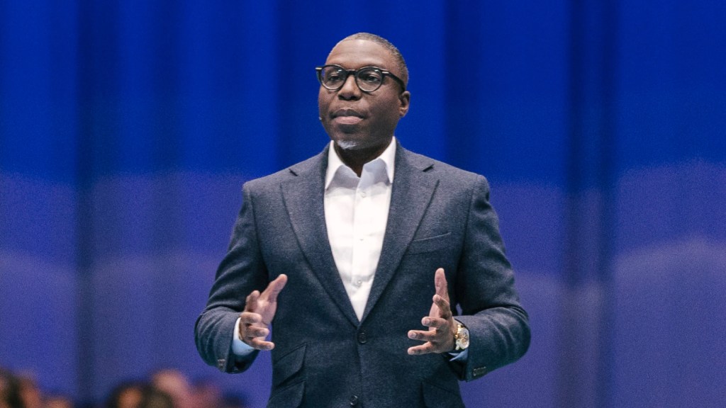 people in front of a giant Einstein character sculpture