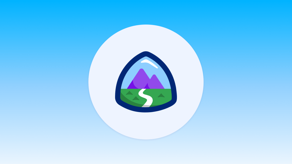 Trailhead badge icon featuring mountains and a winding path inside a shield on a light blue background.